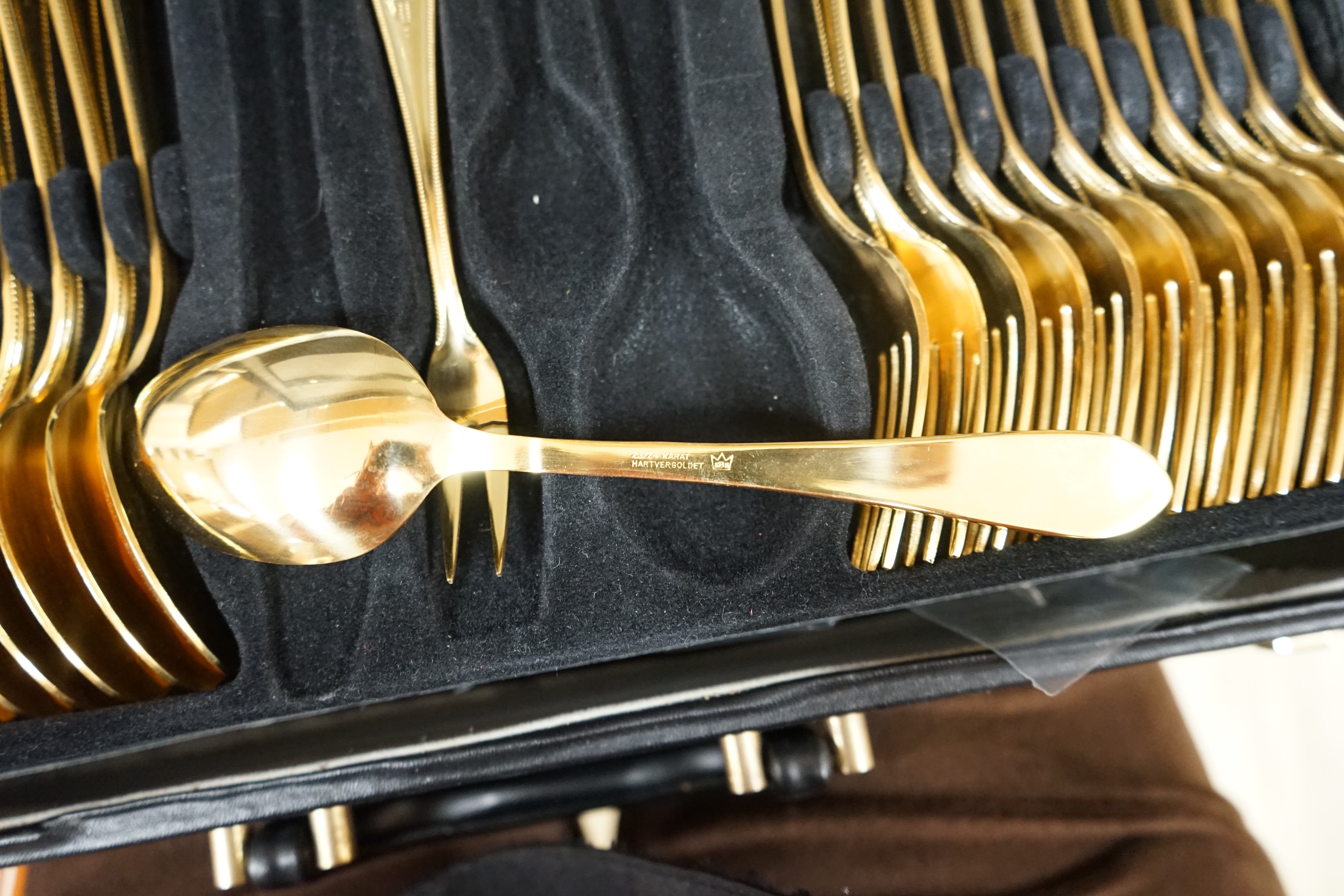 A Bestecke gold plated canteen of cutlery. Condition - good